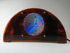 Bulbdial clock with tortoiseshell acrylic case. Bulbdial clock with tortoiseshell acrylic case.